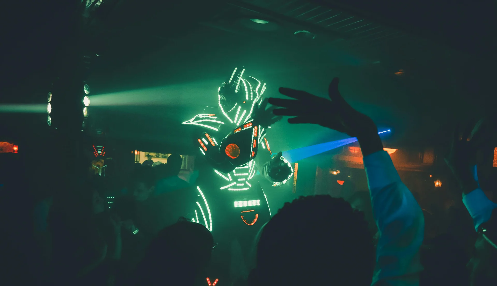 clubber dressed as a robot at night